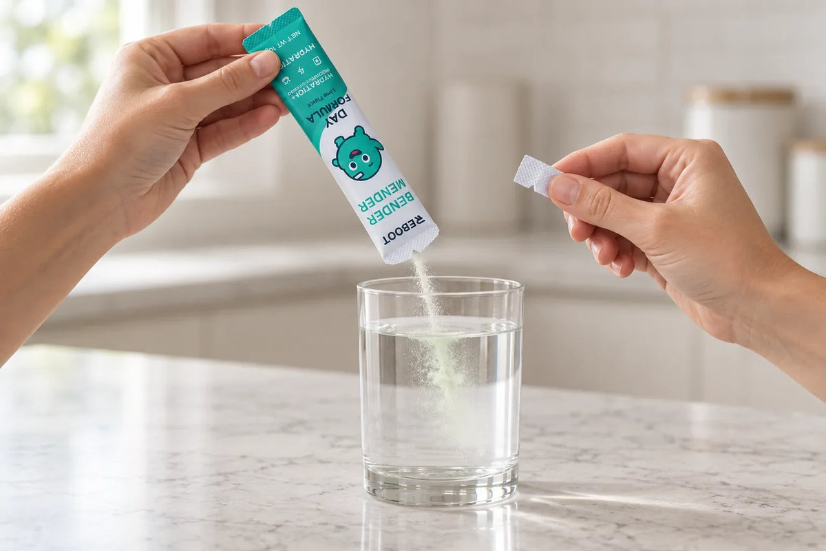 Pouring a Reboot DAY stick into a glass of water